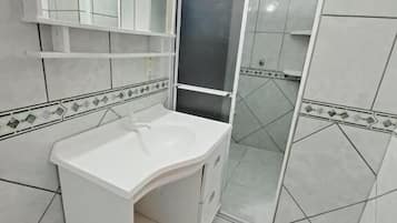 Combined shower/tub, hair dryer, towels, toilet paper