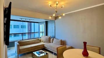 Deluxe Apartment, Partial Ocean View | Living area