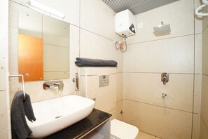 Deluxe Room | Bathroom | Shower, towels, soap - Bidesh Ghar Hotel (Puri)