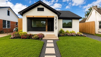 A modern two-story house with a number 3019 displayed on the front.