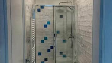 Shower, free toiletries, hair dryer, slippers