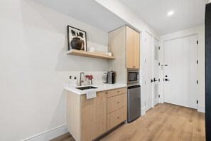 Fridge, microwave, coffee/tea maker, toaster