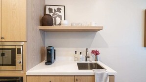 A kitchen with a microwave, coffee maker, and a sink. - Casa Iglesia Studio 206 (Santa Barbara)