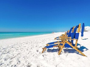 A beach with white sand and a clear blue sky. - Ariel Dunes I 610- Emerald Eden (Miramar Beach)