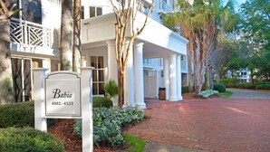 A gated entrance with a sign reading 'Babi' and a contact number. - Bahia 4423- Changes in Latitudes (Miramar Beach)