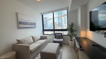 Apartamento, vista para a cidade | Área de estar