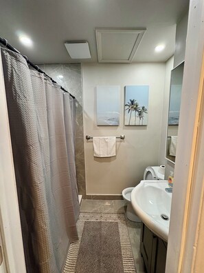 Shower, hair dryer, towels, soap