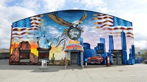 A Sleep Inn Motel with a mural of the Statue of Liberty, an eagle, and a desert landscape.