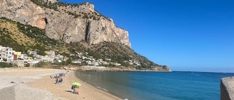 On the beach, sun loungers, beach towels