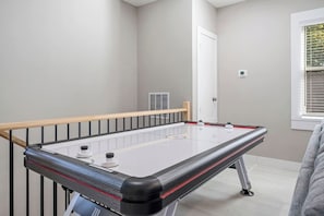 Challenge your family and friends to a little friendly competition at the game room’s air hockey table.