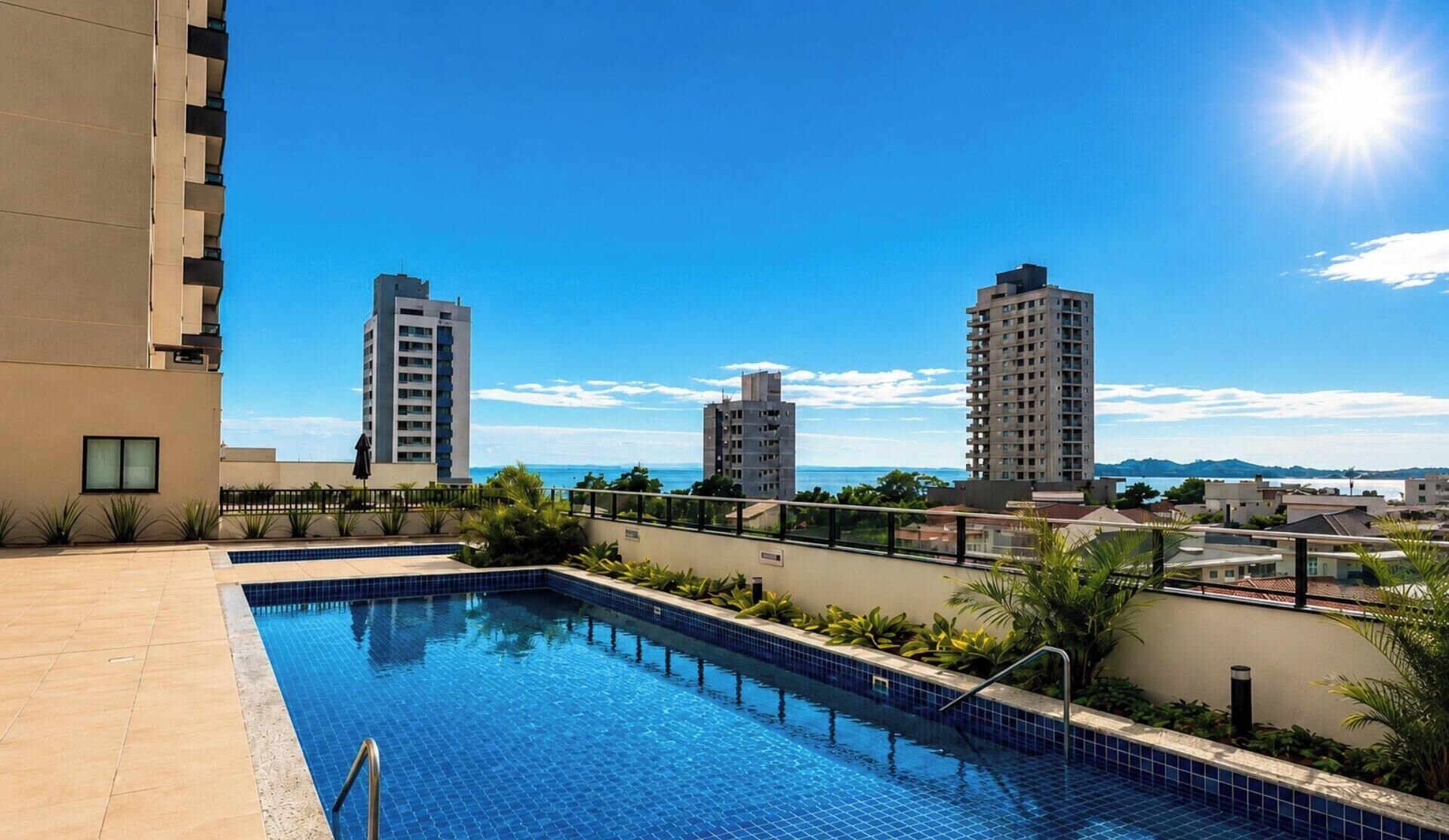 A rooftop pool with a clear view of surrounding buildings and a sunny sky.