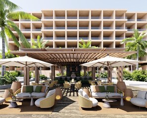A hotel lobby with outdoor seating, a bar, and a pool area. - Park Hyatt Riviera Maya - All Inclusive (Puerto Morelos)