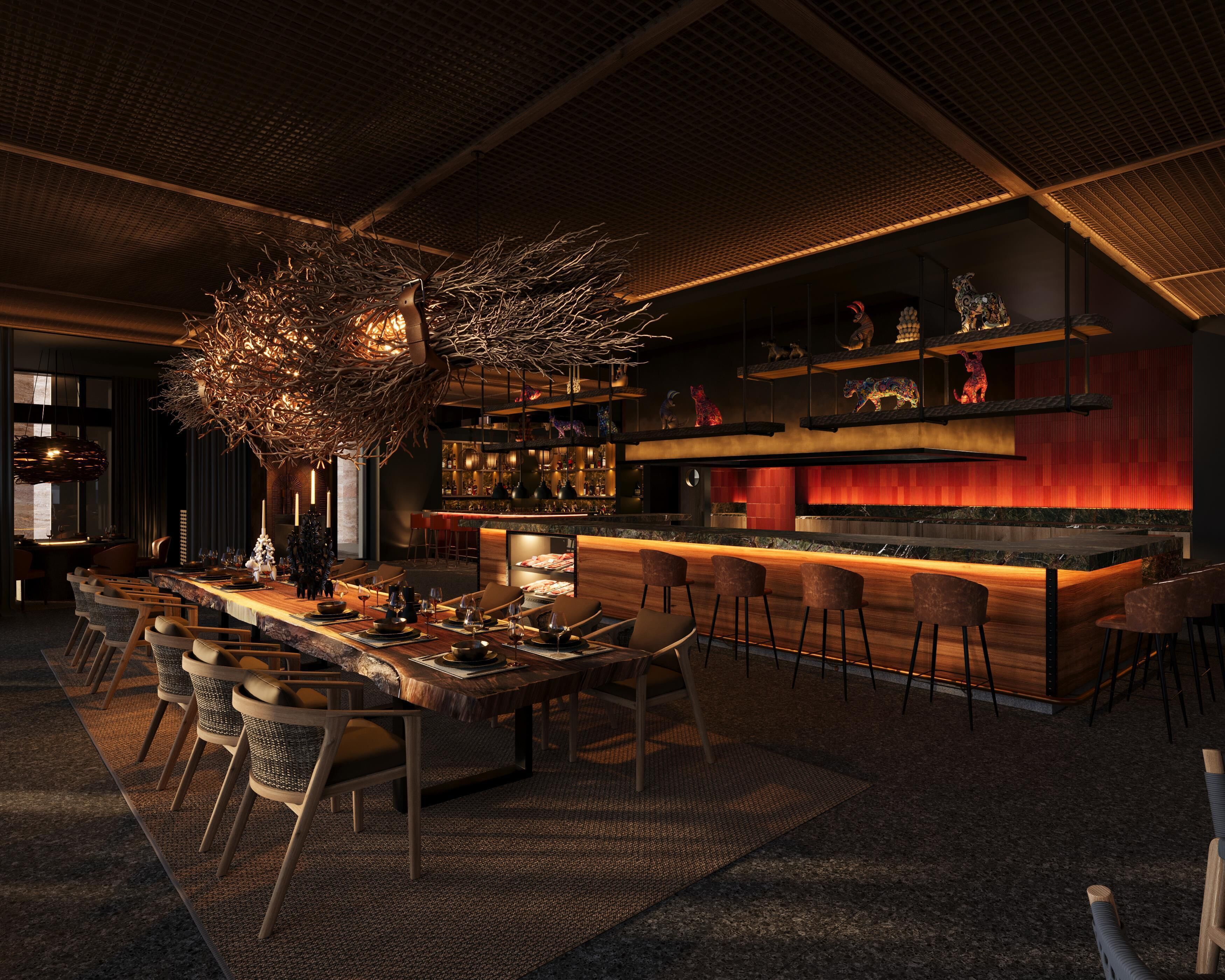 Zona de bar moderna con una barra larga, taburetes y diversos objetos decorativos.