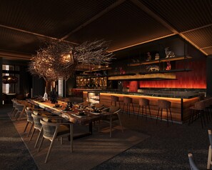 A modern bar area with a long counter, bar stools, and a variety of decorative items. - Park Hyatt Riviera Maya - All Inclusive (Puerto Morelos)