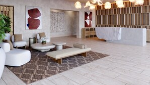 A modern interior with a seating area, a reception desk, and a wall with vertical wooden slats. - Park Hyatt Riviera Maya - All Inclusive (Puerto Morelos)