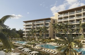 A hotel with multiple balconies, a pool area with sun loungers, and palm trees. - Park Hyatt Riviera Maya - All Inclusive (Puerto Morelos)