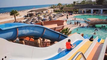 Indoor pool, seasonal outdoor pool, pool umbrellas, lifeguards on site