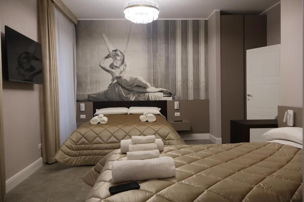 Deluxe Quadruple Room, Courtyard View | In-room safe, desk, iron/ironing board, free WiFi