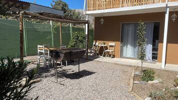 Standard Apartment, Patio, Pool View | Outdoor dining