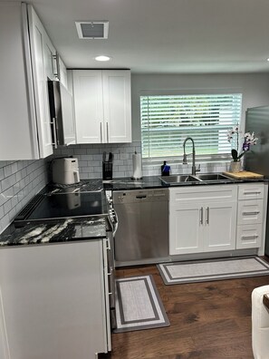 Fridge, microwave, oven, stovetop - Fully Renovated Home Near Beach, Port, Cruises & Boat Ramp (Cocoa)