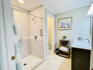 Shower, hair dryer, towels, soap