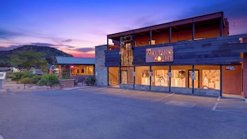 A modern building with a sign reading 'The Melting Point.'
