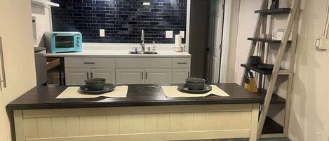 Fridge, microwave, stovetop, coffee/tea maker