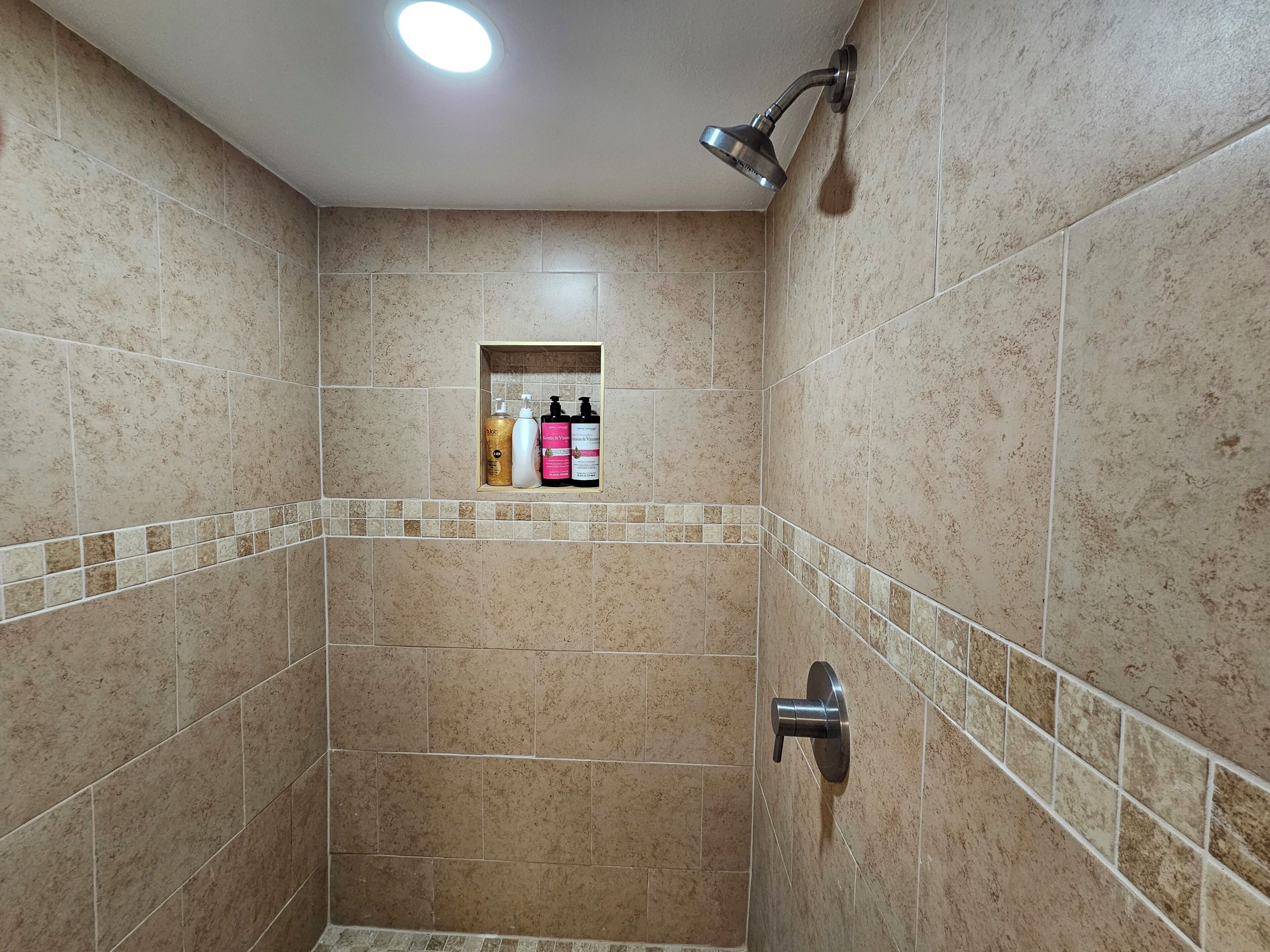 Shower, hair dryer, towels, toilet paper