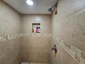 Shower, hair dryer, towels, toilet paper