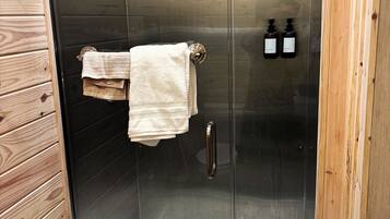 Shower, hair dryer, towels, soap