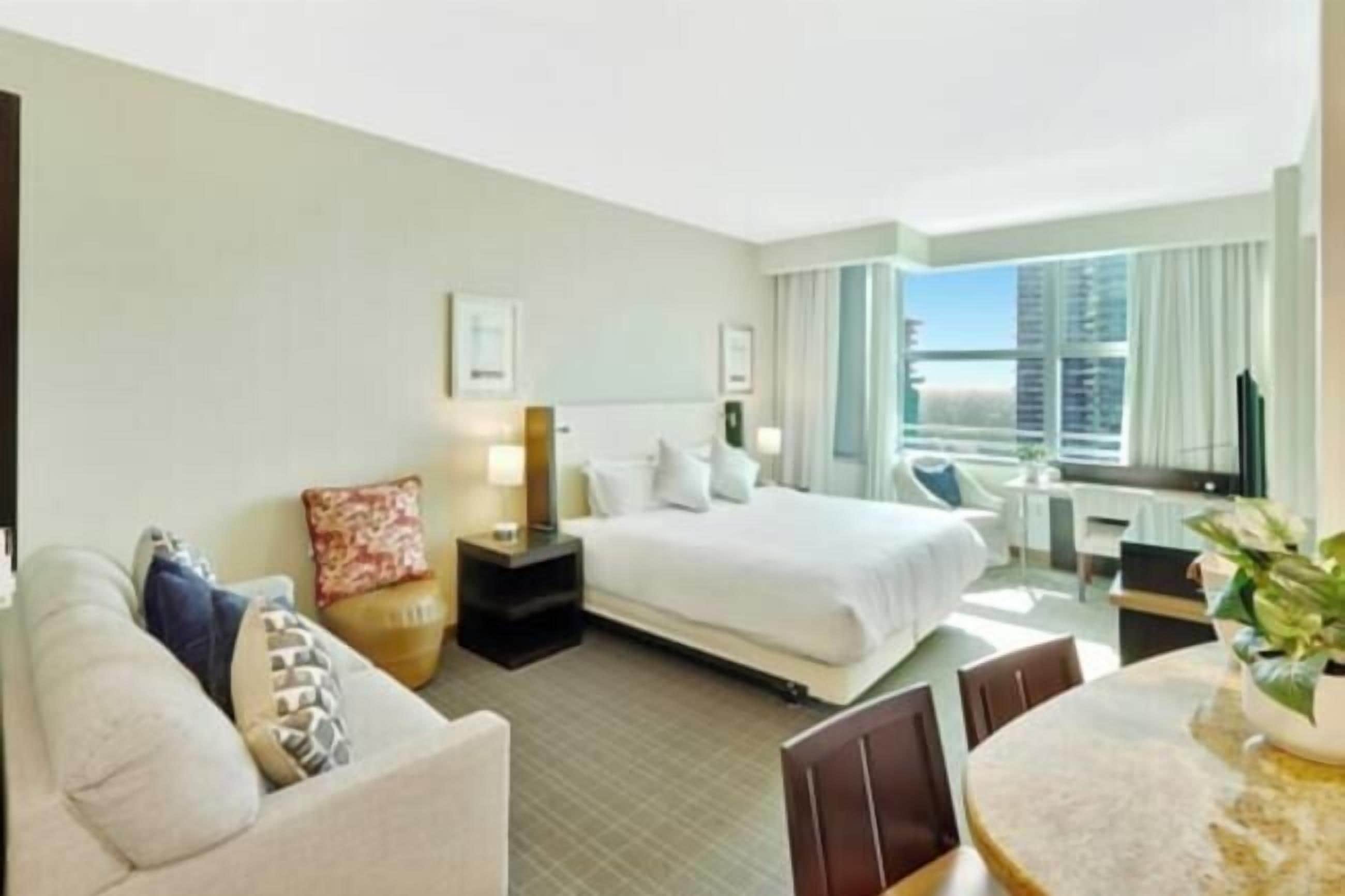 Comfort Condo, City View | Living area | 50-inch Smart TV with digital channels