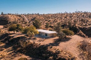 Aerial view of the house on the hilltop - Pipes Canyon Lookout · Hot Tub, Cowboy Tub, Views (Yucca Valley)