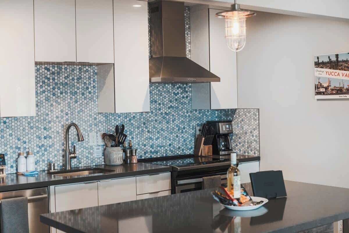 Kitchen counter with blue mosaic backsplash