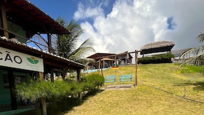 A grassy area with a building labeled 'Bugaendrius Paradise' and a thatched-roof structure.