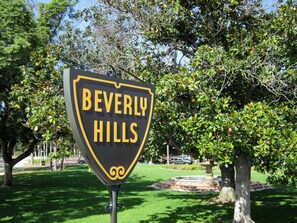 A sign for Beverly Hills with a shield shape and yellow lettering. - 90210 NEST: Private Pool Retreat in Beverly Hills (Beverly Hills)