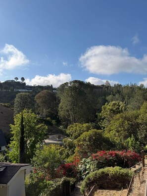 A residential area with a house surrounded by lush greenery and hills in the background. - 90210 NEST: Private Pool Retreat in Beverly Hills (Beverly Hills)