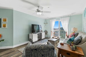 Smart TV, books - OW 1303-Luna Sol: Experience coastal charm in Oak Island, a spacious 2BR condo with ocean views! (Oak Island)