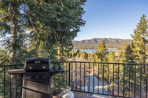 A grill on a balcony overlooking a mountainous landscape. - Lakeview Lodge,HotTub, FirePit, BBQ, firework view (Big Bear Lake)