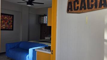 Family Room, 1 King Bed with Sofa bed, Balcony, Courtyard View | Desk, laptop workspace, free WiFi