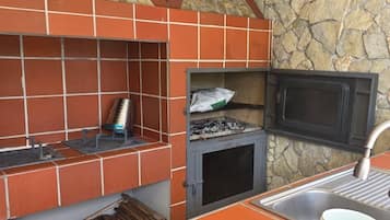 Mini-fridge, microwave, coffee/tea maker, cookware/dishes/utensils