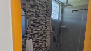 Family Room, 1 King Bed with Sofa bed, Balcony, Courtyard View | Bathroom | Shower, towels, soap, shampoo
