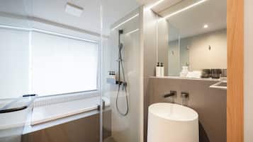 Deluxe Twin Bathtub | Bathroom | Hair dryer, slippers, bidet, towels