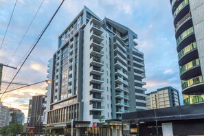 A multi-story hotel with a modern design, featuring balconies on each floor and large windows. - 1b Apartment Southbank. Parking. Long Term Stays (South Brisbane)