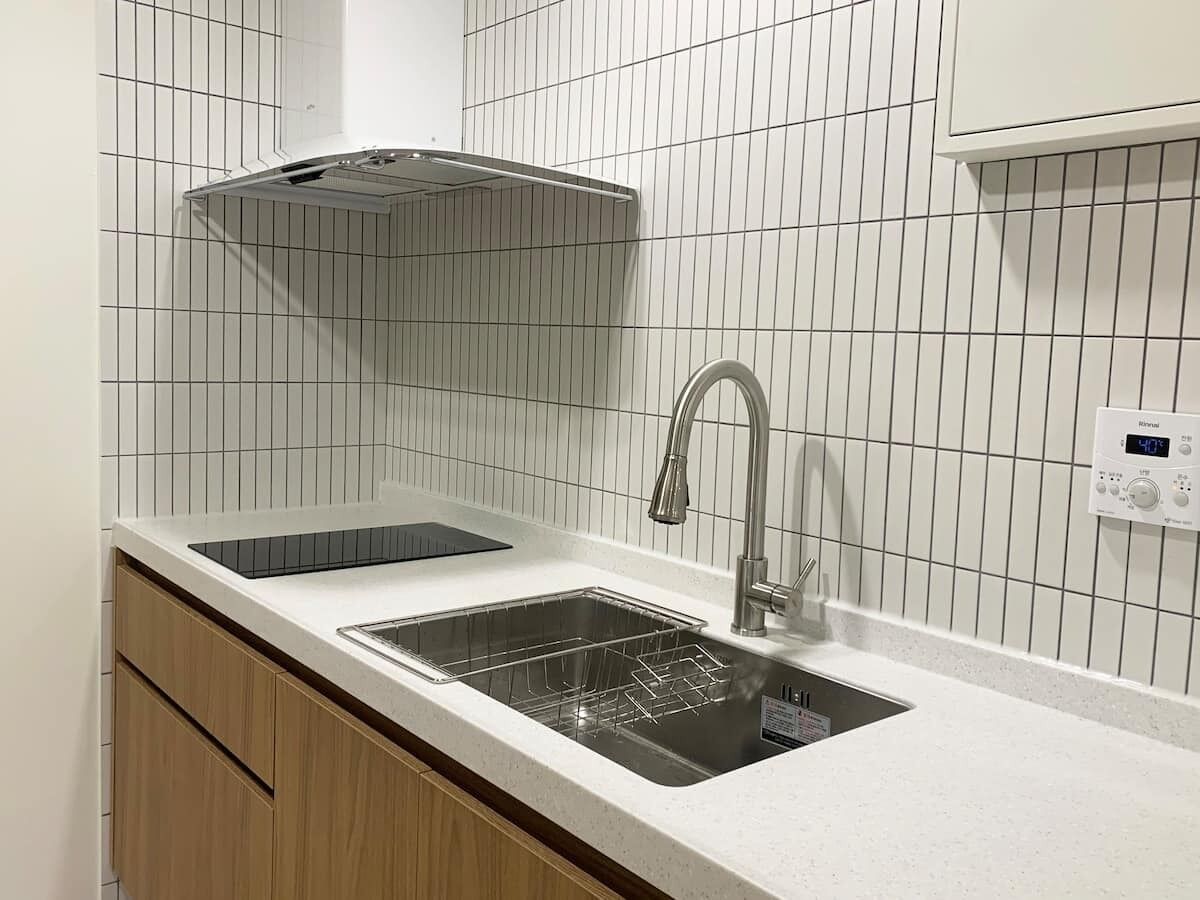 Fridge, electric kettle, dining tables