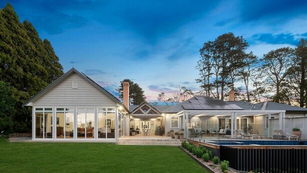 A modern house with a large glass room, a covered patio, and a swimming pool. - “Southern Highlands Estate”, Private Rural Oasis. (Sutton Forest)