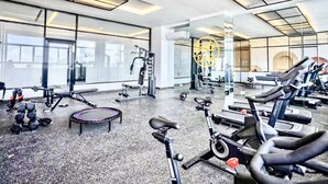 A gym with exercise equipment, large windows, and a modern design. - Modern Luxury Retreat Residence XX11 La Esperilla (Santo Domingo)