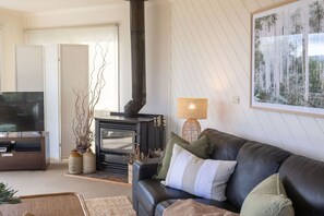 TV, fireplace, books - The Ridge House - Panoramic views! (Aireys Inlet)