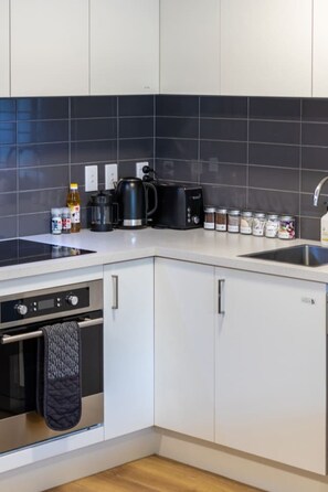 Fridge, microwave, oven, stovetop - Ground Floor Apartment | Parking + Pool & Gym (Christchurch)