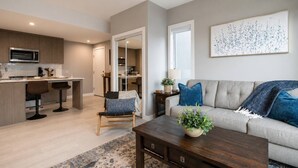TV, stereo - Brand New King Bed Condo w Gym Stampede & 17 Ave (Calgary)