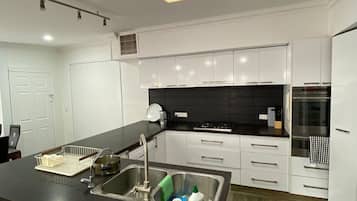Fridge, stovetop, cookware/dishes/utensils, dining tables